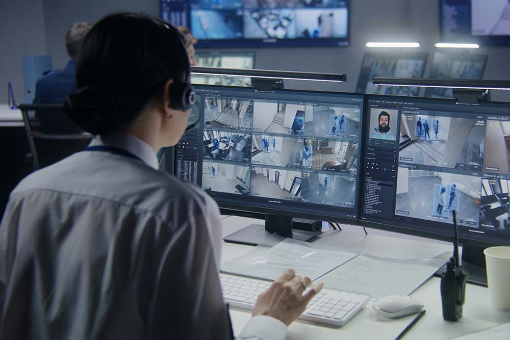 Female employee works in security control center on premise security, on premise access control, 1# Toronto Security company, best security company Toronto, experienced security company toronto safelink group, P8MX+GC Brampton, Ontario